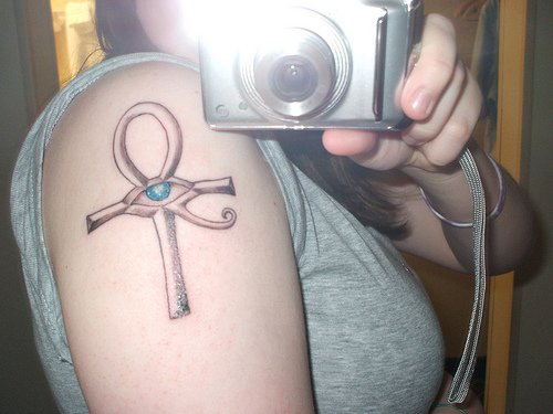 Grey Ink Ankh And Horus Eye Tattoo On Right Shoulder